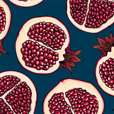 Split pomegranates on blue